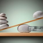 Unbalance concept. Balancing stones on the shelf.