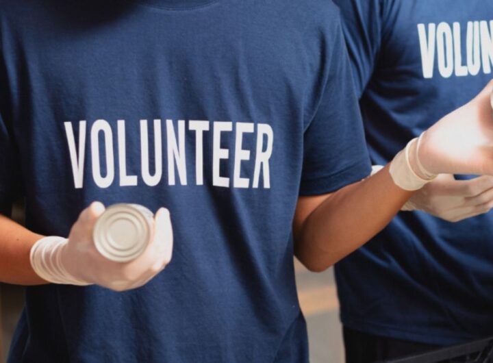 A males'd t-shirt with "volunteer"inscribed on it