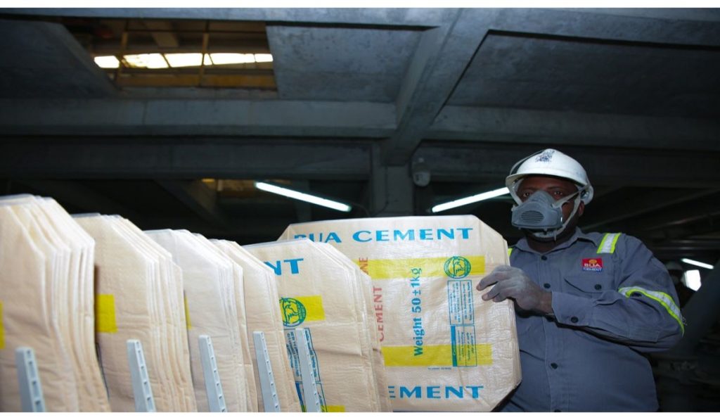 Factory worker with cement bags