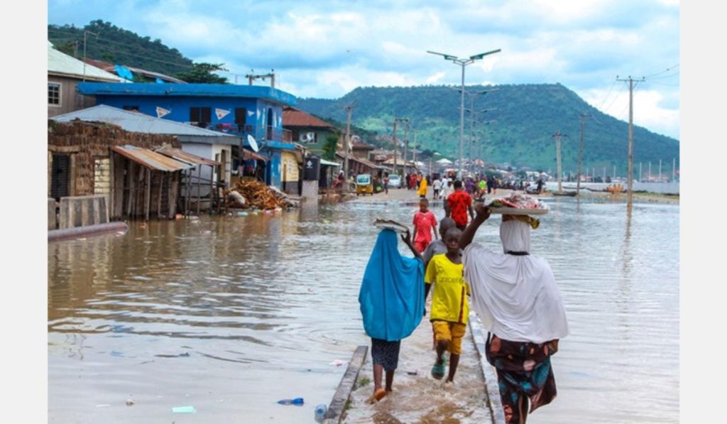 A group of people commuting and flood around them