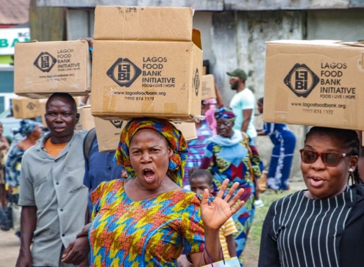 A crowd of women carrying box from Lagos Food Bank