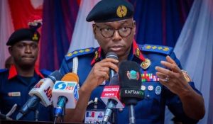 Photo of Dr. Ahmed Abubakar Audi, OFR, mni speaking on a podium