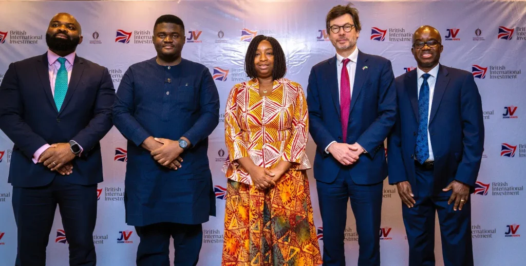 Group photo of 4 men and a woman in the middle