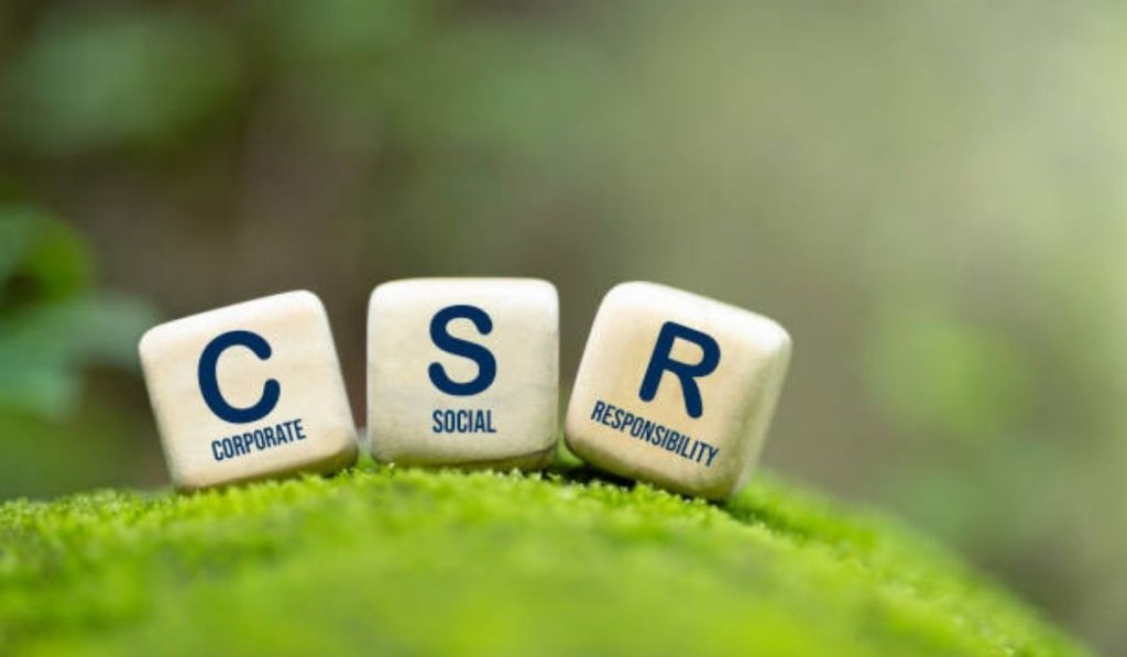 Three dice with CSR inscribed on each and Corporate Social Responsibility on each