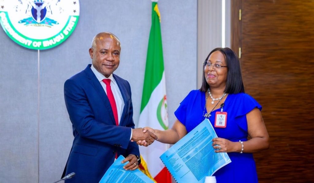 Governor Peter Mbah of Enugu State shakes hands with UNICEF's Chief of Field Office, Enugu, Mrs. Juliet Chiluwe