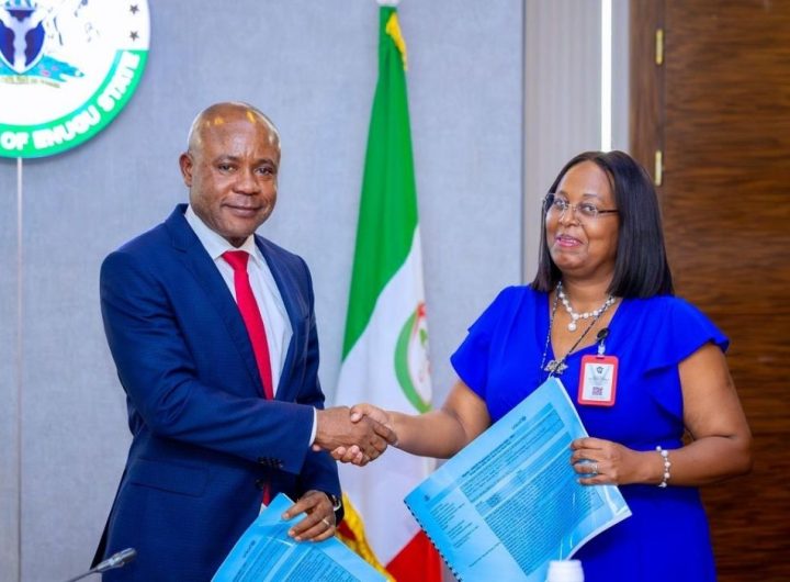 Governor Peter Mbah of Enugu State shakes hands with UNICEF's Chief of Field Office, Enugu, Mrs. Juliet Chiluwe