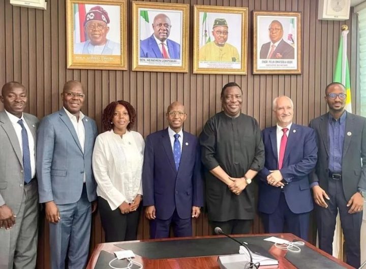 Group photo of 7 people in a conference room