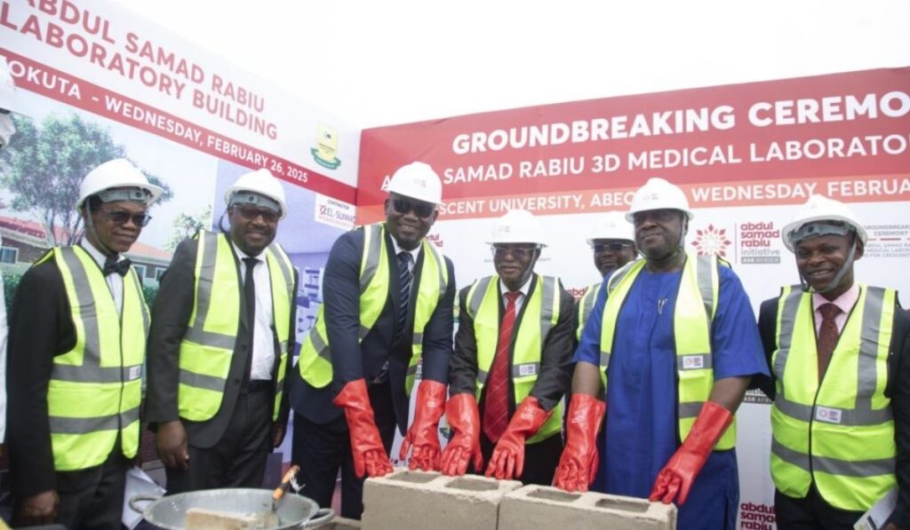 6 men in group photo wearing construction helmets and jacket