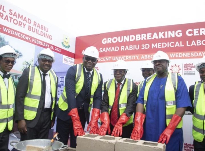 6 men in group photo wearing construction helmets and jacket