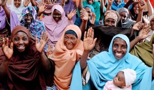 Group of happy African women raising their hands