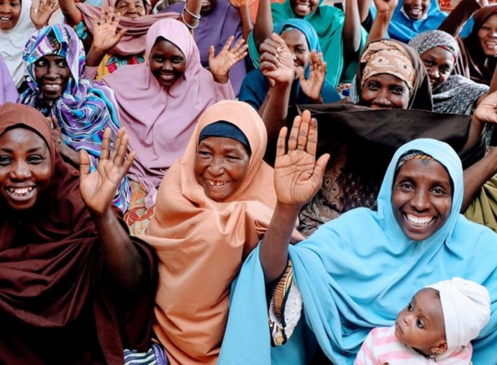 Group of happy African women raising their hands