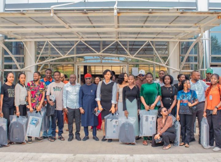 Officials of the Presidential Amnesty Programme in group photograph with PAP final year and post-graduate scholarship students at Baze University during the presentation of laptops to them on Monday, April 7, 2025.