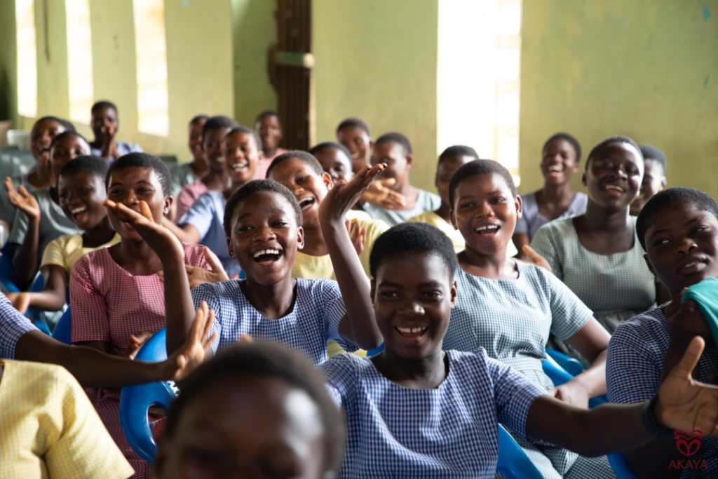 Happy school students who are beneficiaries a of philanthropic donation and CSR initiative