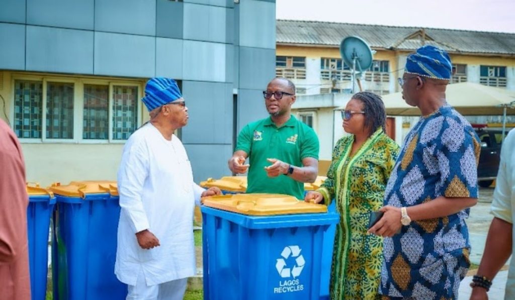 Group photo with the donated smart bins from Lee Group to LAWMA