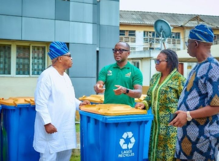 Group photo with the donated smart bins from Lee Group to LAWMA