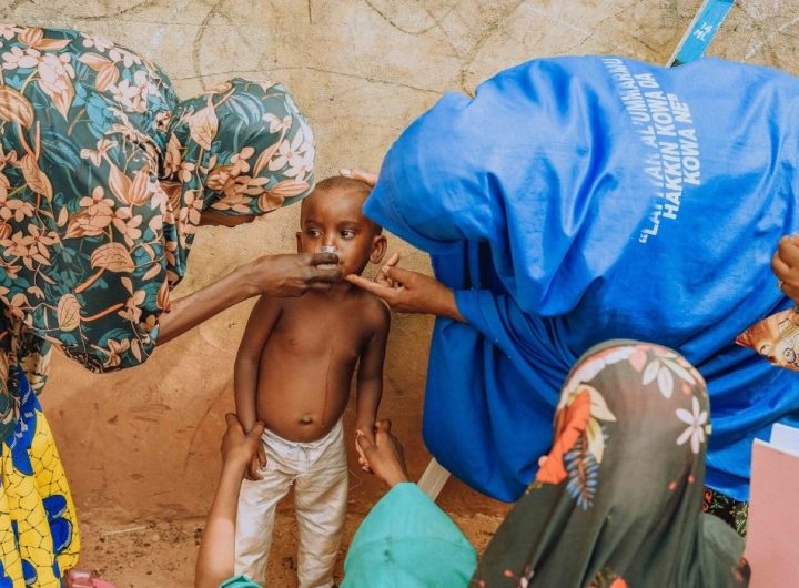 The Sarmaan Project (SP) staff giving azithromycin to a child to reduce infant mortality