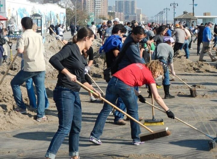 Volunteers sweeping the streets