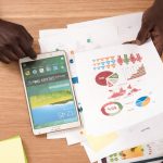 Image of man looking through a report