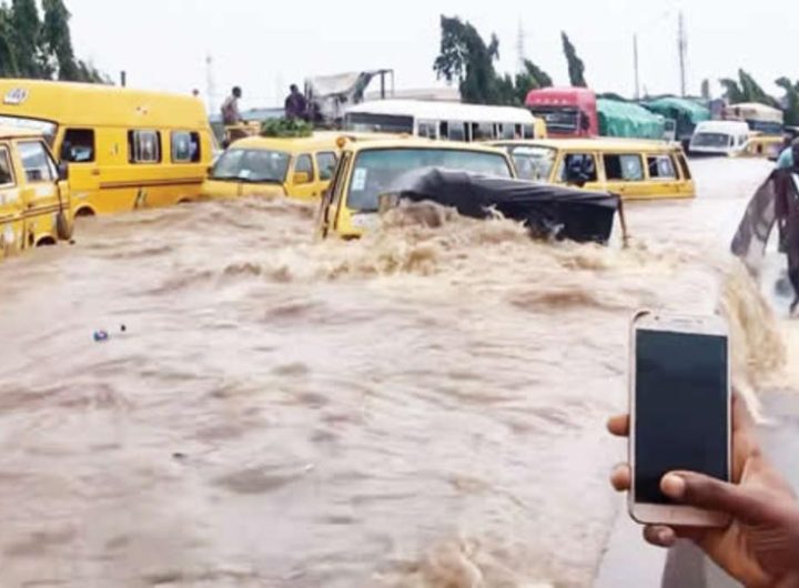 Flooding in Lagos with yellow buses inside flood