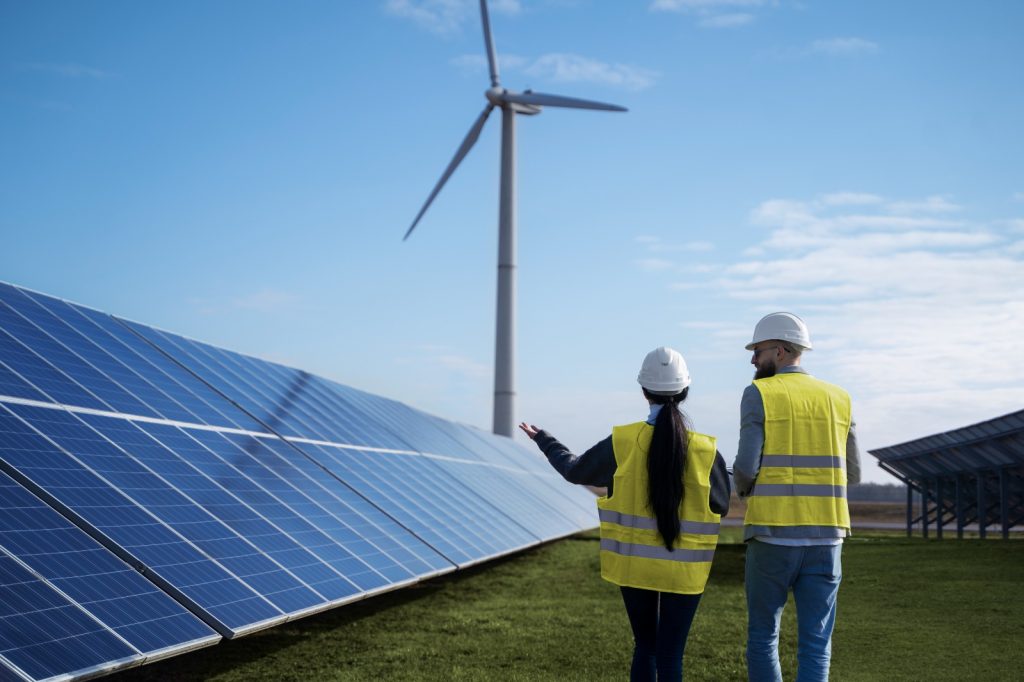 Two engineers around a solar panel