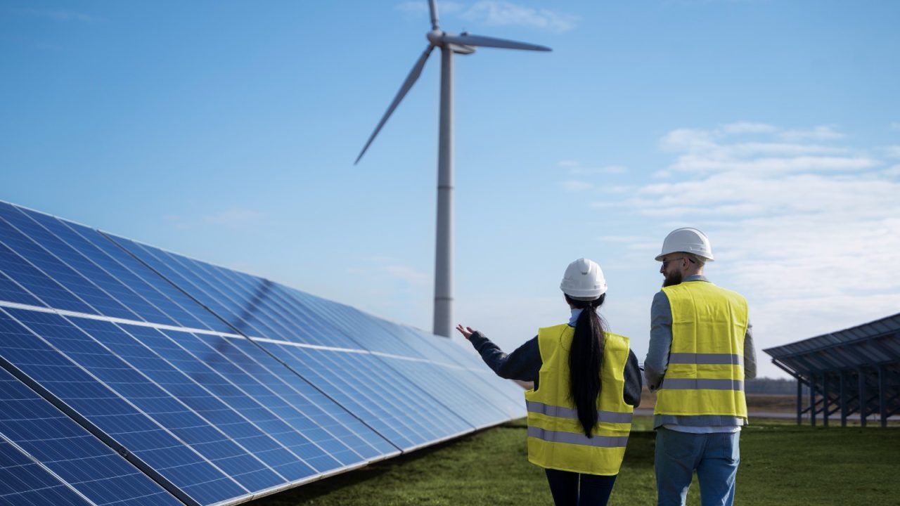 Two engineers around a solar panel