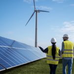 Two engineers around a solar panel