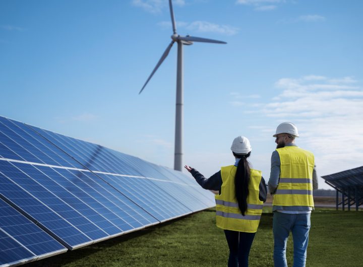 Two engineers around a solar panel