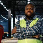 Nigerian male worker not smiling