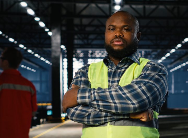 Nigerian male worker not smiling