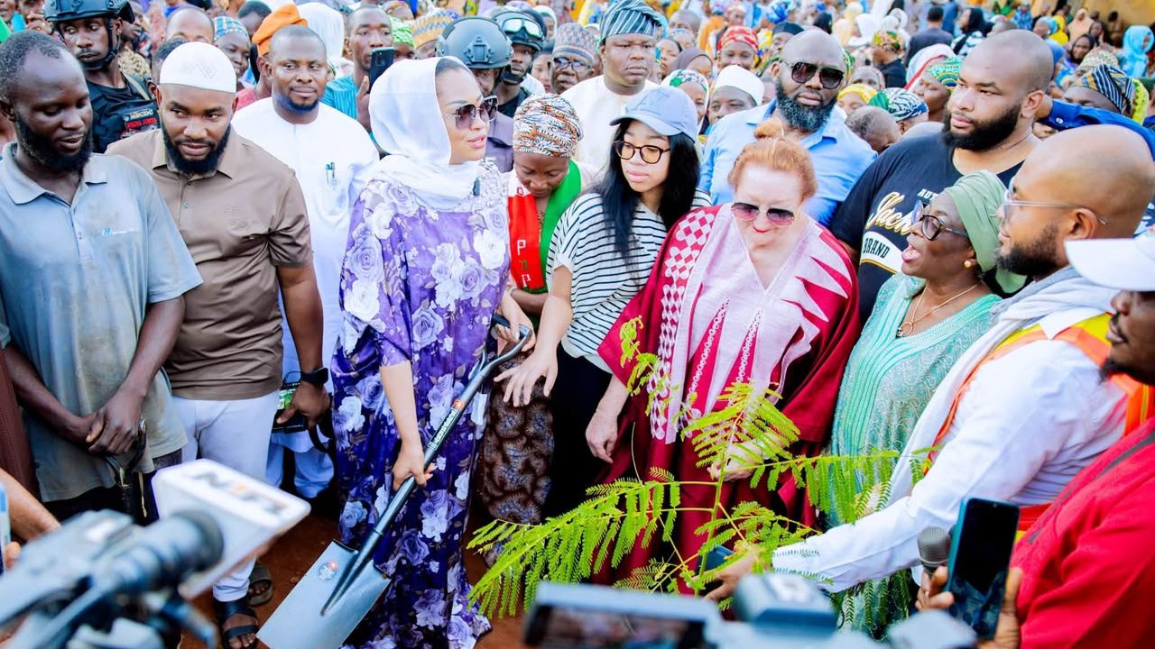 Senator holding shovel during tree planting